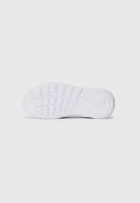 White sneaker sole with a textured tread pattern. Includes visible Nike logo, flex grooves, and smooth areas for traction.