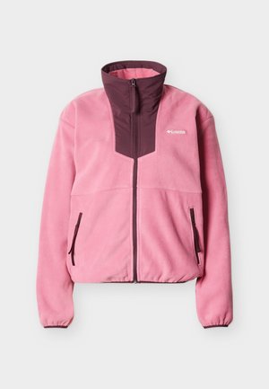 Ροζ fleece μπουφάν με πάνελ φερμουάρ σε σκούρο μπορντό, πλήρες φερμουάρ μπροστά, δύο πλευρικές τσέπες με φερμουάρ και ελαστικά μανσάκια. Λογότυπο Columbia στο στήθος.