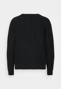 Svart stickad tröja med ett texturerat mönster, med en kabeldesign som går ner i mitten och ribbade muddar och nederkant.