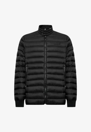 Giacca imbottita trapuntata nera con colletto rialzato, cerniera frontale, due tasche laterali con zip e polsini a costine.
