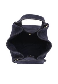 Navy suede handbag with an open top and gold hardware accents. Features a soft, textured finish and contrasting white stitching.