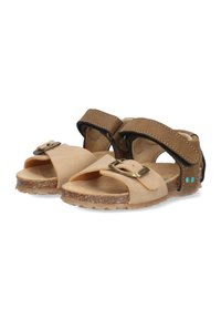 Tan leren sandalen met een verstelbare band, decoratieve gesp en kurken zool. Beschikt over een gestructureerde bovenkant en contrasterende stiksels.