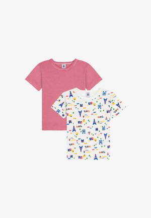 Two short-sleeve t-shirts: one red with white stripes, and another white with a colorful print of landmarks and cars. Cotton fabric, round neck.
