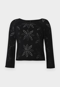 Zwart cropped sweater met lange mouwen, voorzien van een bloemenpatroon dat is gemaakt door een open breiwerk. Ronde halslijn en geribbelde zoomdetails.