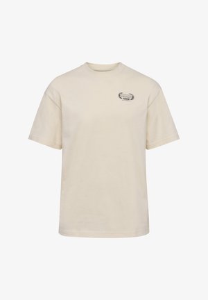 T-shirt in cotone beige con maniche corte, scollatura rotonda e una piccola etichetta logo "SWARM" sul petto sinistro. Tessuto morbido, vestibilità regolare.