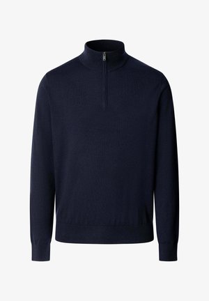 Laivastonsininen pitkähihaisen pooloneule, jossa on korkeahko kaulus ja etupuolen puolivälissä oleva vetoketjukiinnitys, resorit helmassa ja hihoissa.