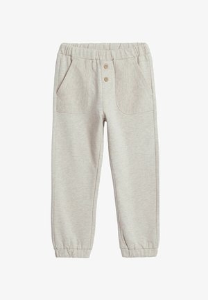 Lys grå joggers lavet af blødt stof. Elastisk talje med to knapper, med ribbede sidelommer og elastiske manchetter ved anklerne.