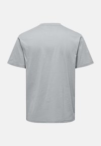 Gray short-sleeve t-shirt made of cotton fabric. Simple, solid color with a crew neck and straight hem, featuring a smooth texture.