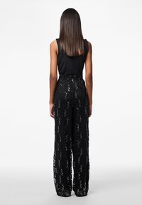 Pieces PCROXY   - Trousers - black