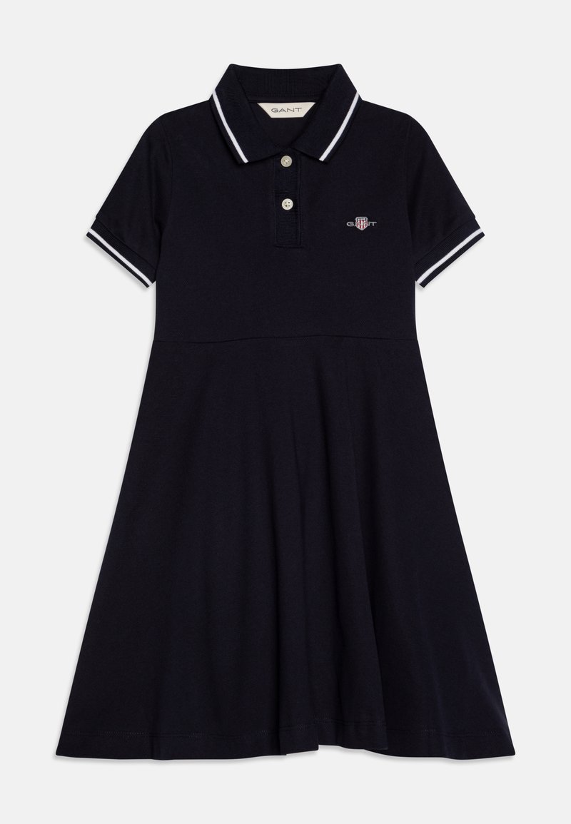 Navy polo dress made of cotton, featuring a collared neck, short sleeves with white accents, an A-line shape, and a small logo on the chest.