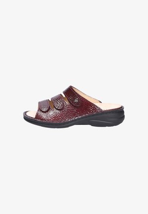 Open-toe slide sandal in burgundy textured leather with two adjustable straps and a cushioned black sole for comfort.