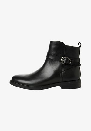 Black leather ankle boot with a rounded toe, low heel, and a decorative strap with a metal buckle across the upper. Textured finish.