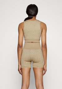 Björn Borg SEAMLESS LIGHT CROP - Top - off-white