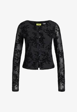 Must mustaga pikad varrukad cardigan, millel on tekstuuriga lillemuster. Omab ümarat kaelust, nööpide ette ja läbipaistvaid varrukaid, millel on tikitud detailid.
