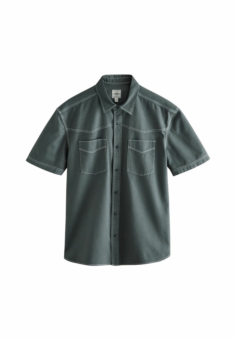 Short-sleeve shirt in dark green cotton, featuring a button-up front, two chest pockets, and contrasting stitching patterns.