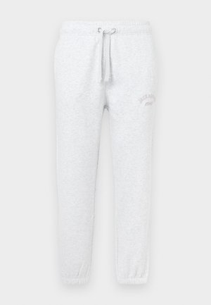 Lys grå sweatpants lavet af blødt stof, med en elastisk talje og snøre samt elastiske manchetter ved anklerne.