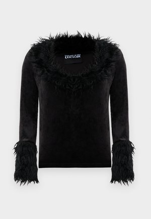Black long-sleeve velvet top with fluffy trim on the neckline and cuffs, labeled Versace Jeans Couture.