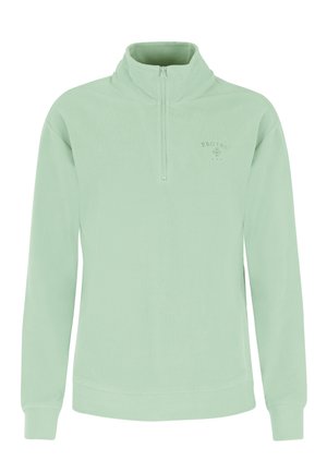 Svijetlozelena, rebrasta majica s kratkim patentnim zatvaračem, visokim ovratnikom i dugim rukavima, s malim logotipom na prsima. Mekana tekstura.