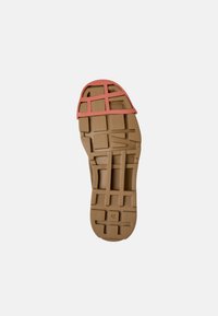 Sole with a brown rubber base, featuring a coral-colored upper grid design. Includes size 42 marking and textured grip patterns.