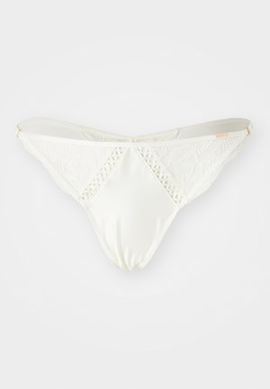Hvit blonde og sateng thong, med intrikate blonder detaljer på sidene og en glatt sateng foran med en diamantform.