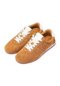 Brown suede sneakers with white laces and accents, round toe, and textured surface. Features white stitching and a brown rubber sole.