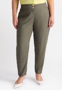 Olive green tapered trousers with a smooth texture, featuring two front buttons, side pockets, and a mid-rise waistband.