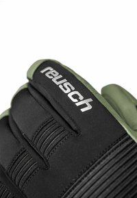 Black goalkeeper gloves with green accents, featuring a textured grip area, elastic straps, and a silver "Reusch" logo on the back.