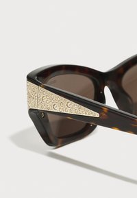 Swarovski Napszemüvegek - dark havana