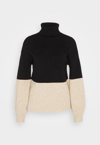 Schwarzer und cremefarbener Rollkragenpullover mit gerippter Textur, langen Ärmeln und einem Farbblockdesign mit einem breiten schwarzen Band oben.