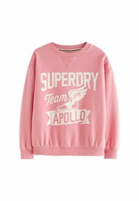 Rosa sweatshirt tillverkad av bomullsblandning, med vit "SUPERDRY" logotyp och grafik. Rundad hals, ribbade ärmslut och fåll. Klassisk passform.