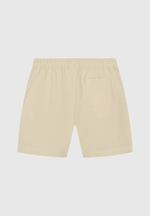 Crème kleurige shorts met een elastische tailleband en een enkele achterzak. De stof heeft een gestructureerde, lichte uitstraling.