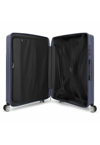 Valigia rigida espandibile di colore blu navy, con interno nero dotato di tasca in rete, cinghie incrociate e quattro ruote multidirezionali per una facile mobilità.