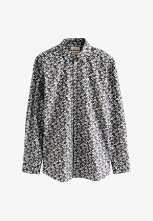 Paitalangalla pitkähihaista puseroa tummansinisenä, jossa on kukkakuosi, jossa on valkoisia ja vaaleansinisiä kukkia. Valmistettu sileästä kankaasta, rento malli.