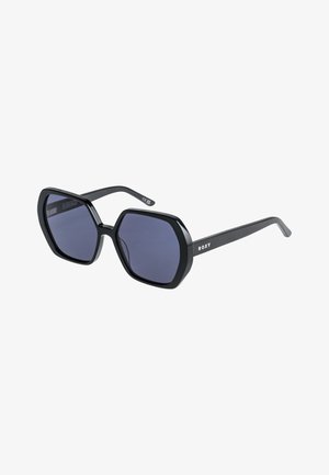 Sorte oktagonale solbriller med mørkt tonede linser, tyk, blank ramme og med 'ROXY' mærket på stilken. Slankt og kontureret design.