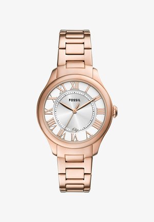 Rose gold Fossil watch with a round case, white dial, Roman numerals, and a linked bracelet. Features a date display at 6 o'clock.