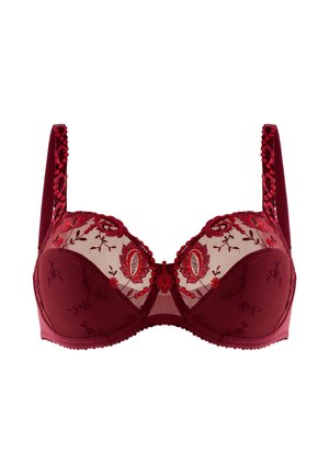 Reggiseno rosso con coppe in rete trasparente, ricamo floreale, spalline decorative e bordi a scallop. Presenta il ferretto per supporto e un dettaglio centrale a fiocco.