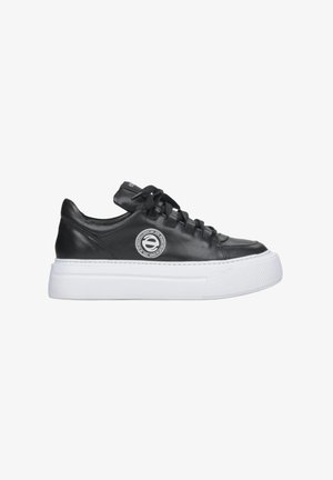 Black leather sneakers feature a rounded toe, white platform sole, and prominent logo detail on the side. Laced closure and smooth texture.