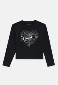 Black long-sleeve crop top featuring a sparkling heart design with the word "Guess" in a cursive font, made from soft, organic cotton.