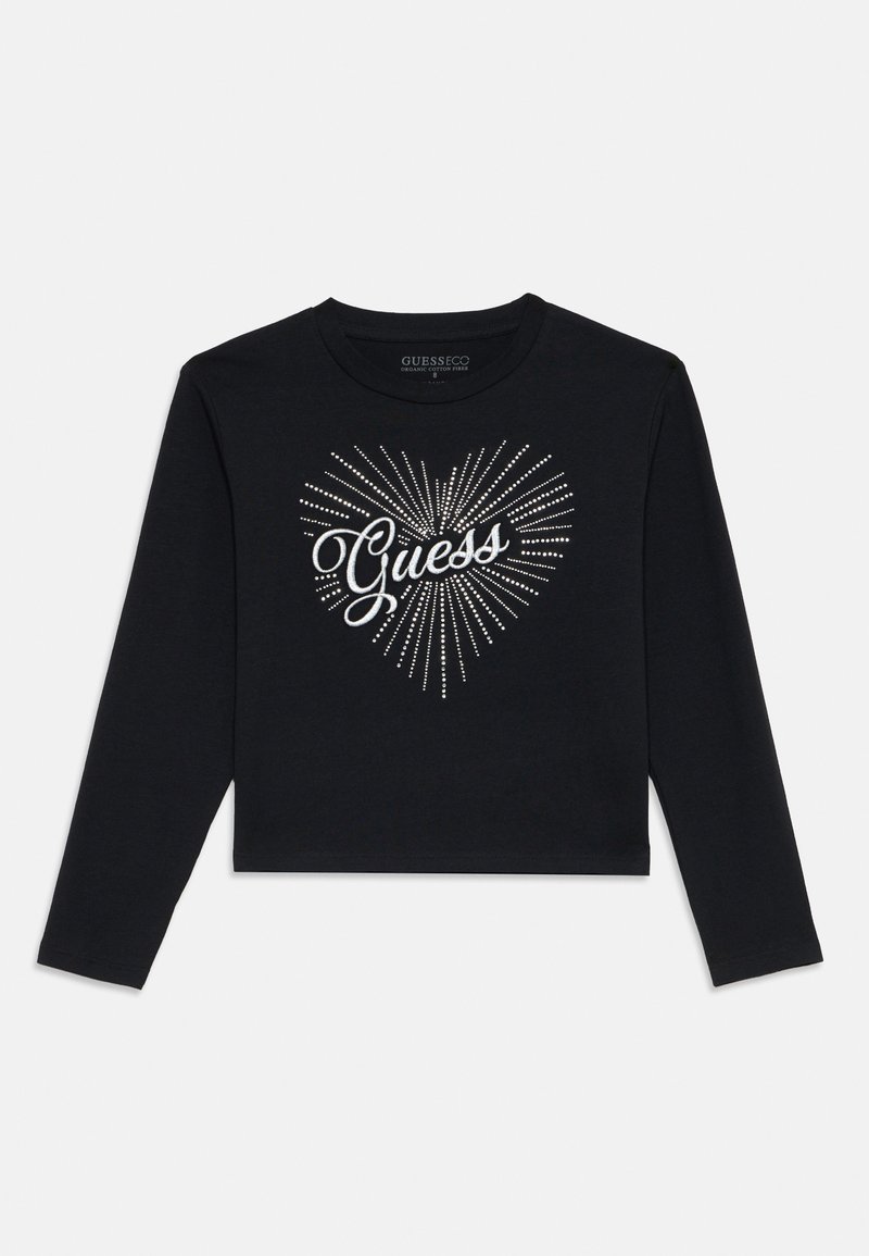 Svart langermet crop top med et glitrende hjerte-design som har ordet "Guess" i kursiv skrift, laget av myk, økologisk bomull.