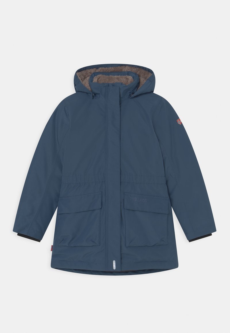 Navy blue waterproof parka with hood, plush brown lining, two front pockets, elastic cuffs, and a logo on the sleeve.