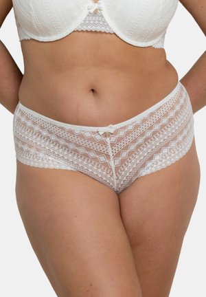 Culotte en dentelle blanche avec un motif géométrique en diamants, dotée d'une taille lisse et d'un nœud décoratif à l'avant.