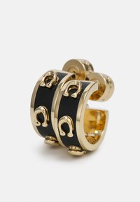 Gold and black cuff earrings featuring a curved design, glossy black band, and small gold accents shaped like horseshoes.