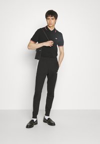 Lacoste - Pantaloni de trening - black/silver chine Imagine miniatură 1