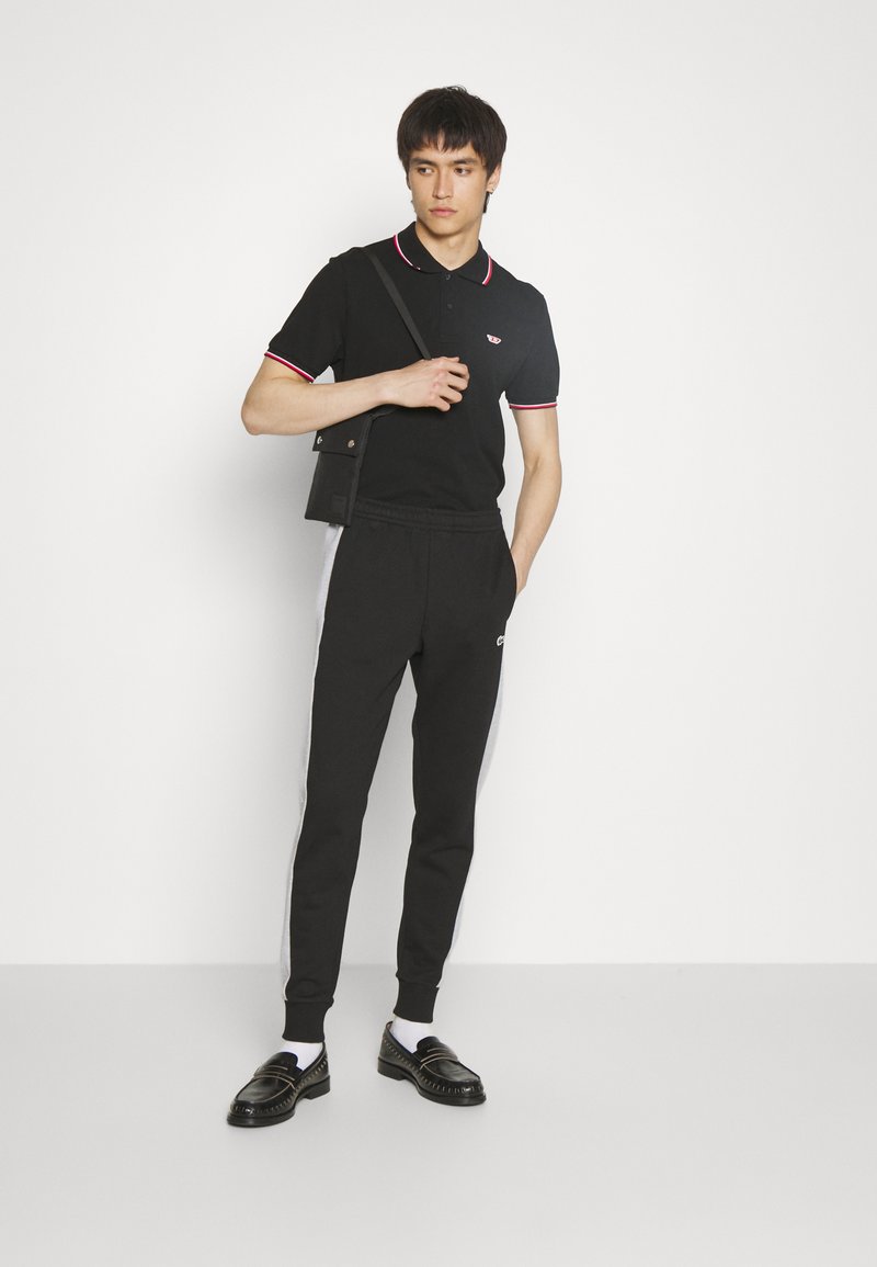 Lacoste Trainingsbroek - black/silver chine