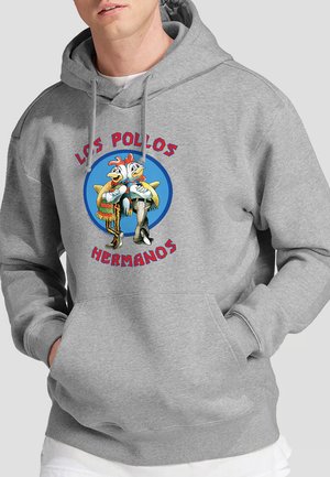 Grauer Kapuzenpullover mit einem Cartoon-Hühnchen-Design auf der Vorderseite. Der Text lautet "LOS POLLOS HERMANOS" in roten Buchstaben. Material aus Baumwollmischung.