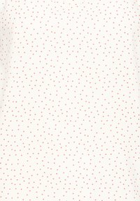 Tissu blanc avec un motif de petits points rouges espacés de manière régulière sur toute la surface.