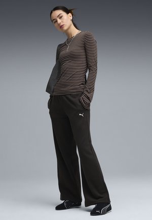 Puma, ESSENTIALS CAT FLEECE HOSE MIT WEITEM BEIN - Pantalones deportivos - black