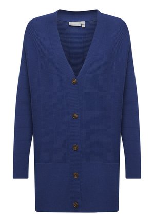Sinine ribitud kardigan V-kaelusega, pikkade varrukatega ja viie pruuni nupuga ees. Omab eespooltaskuid ja lõdvat lõike.