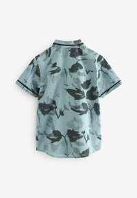 Kurzarmhemd in Hellblau mit floralem Druck in Schwarz. Mit kontrastierendem Kragen und glattem Material, hat eine entspannte Passform.