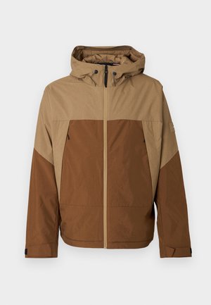 Brązowa i beżowa kurtka z kapturem na zamek błyskawiczny z przodu, z teksturowanym górnym fragmentem i jednolitym dolnym fragmentem, regulowanym kapturem oraz kieszeniami po bokach.